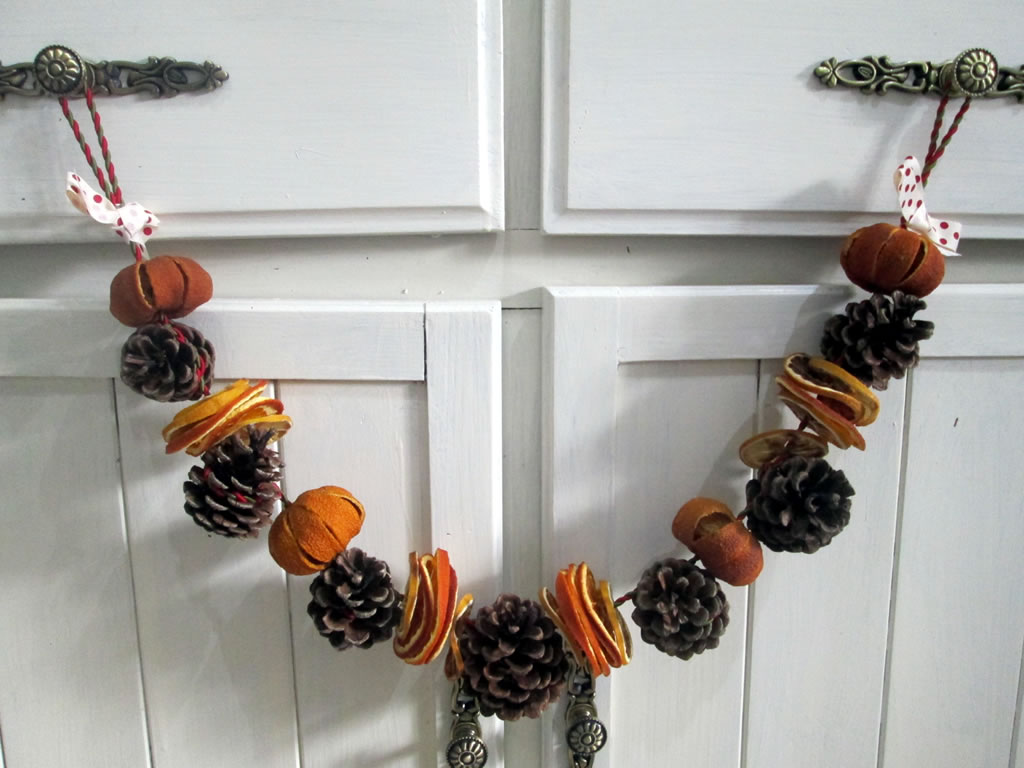 pine cone garland using dried fruit for christmas decorations