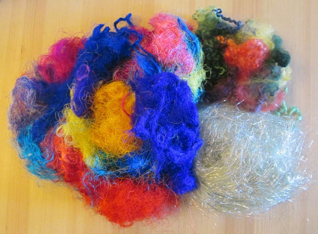 adding fibres to handmade felt