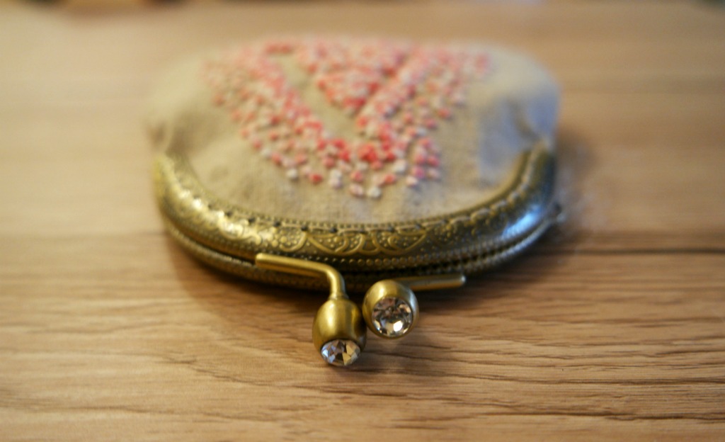 negative space embroidery clasp purse